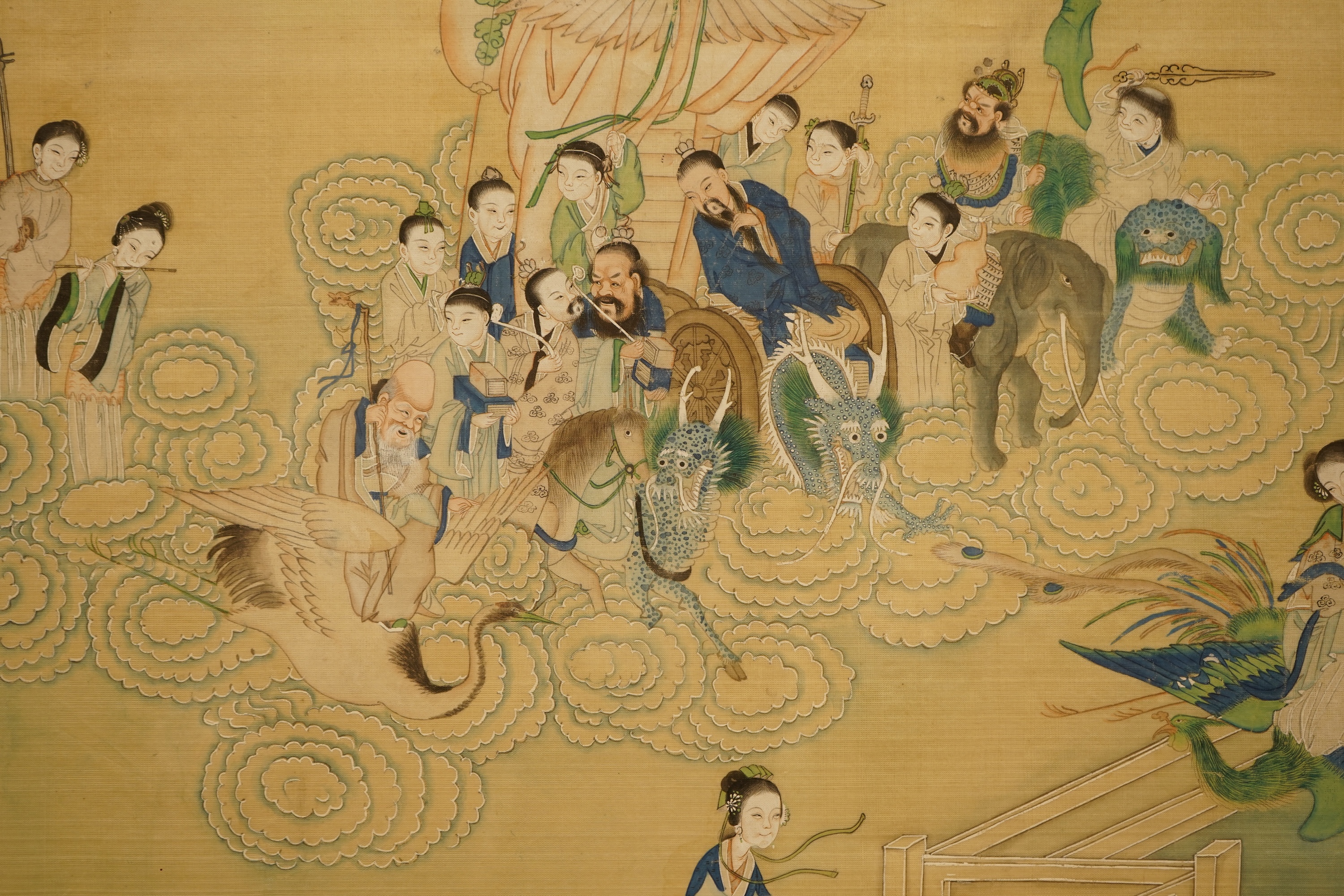 Chinese School (early 20th century), a pair of paintings on silk, Immortals in the heavens including Shou Lao and Xi Wangmu and figures by a lake, 35 x 53cm